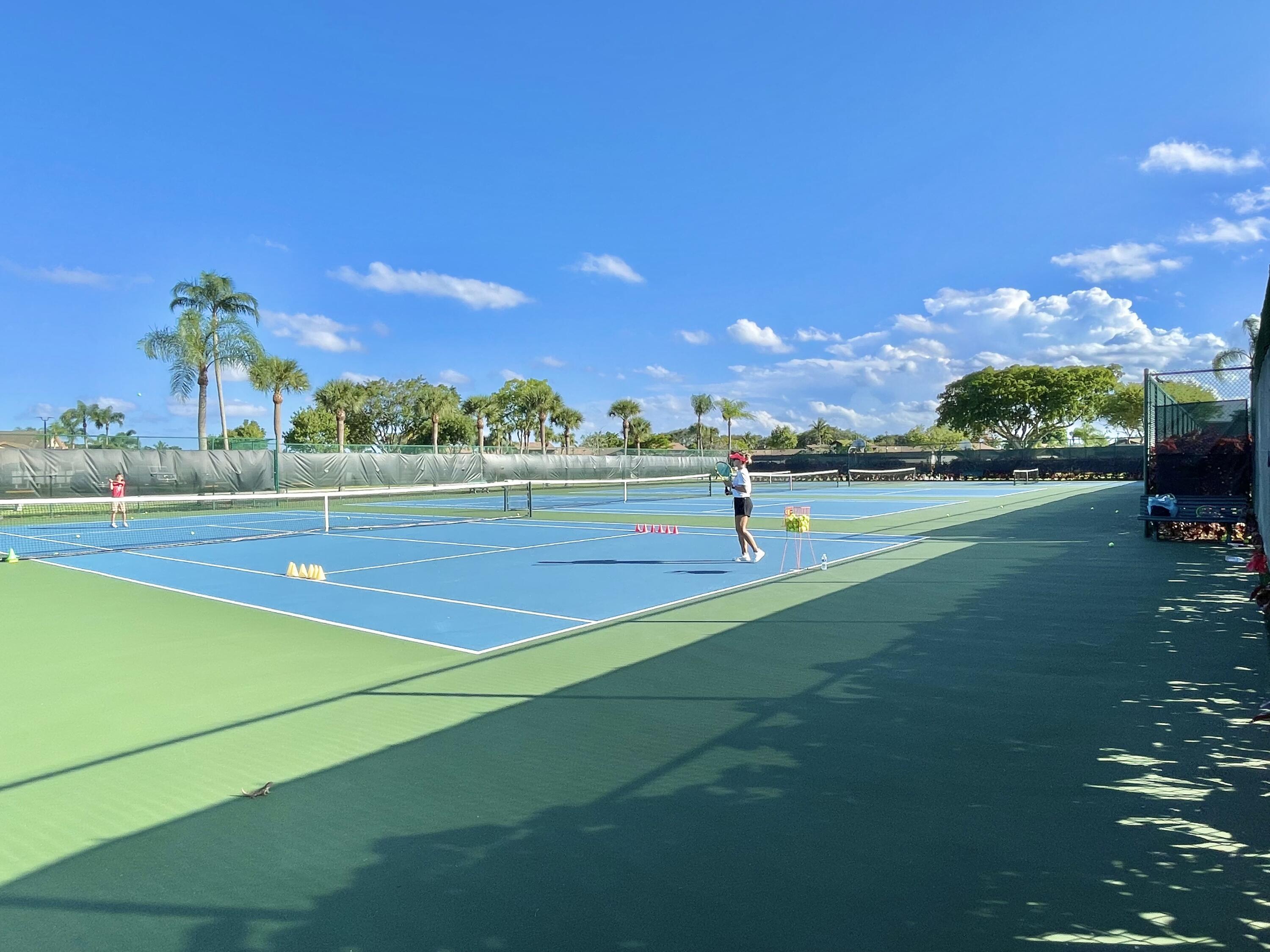 9190 Boca Gardens Parkway, Unit B Boca Raton, FL 33496 - Photo 30 of 35 a view of an outdoor space and tennis court
