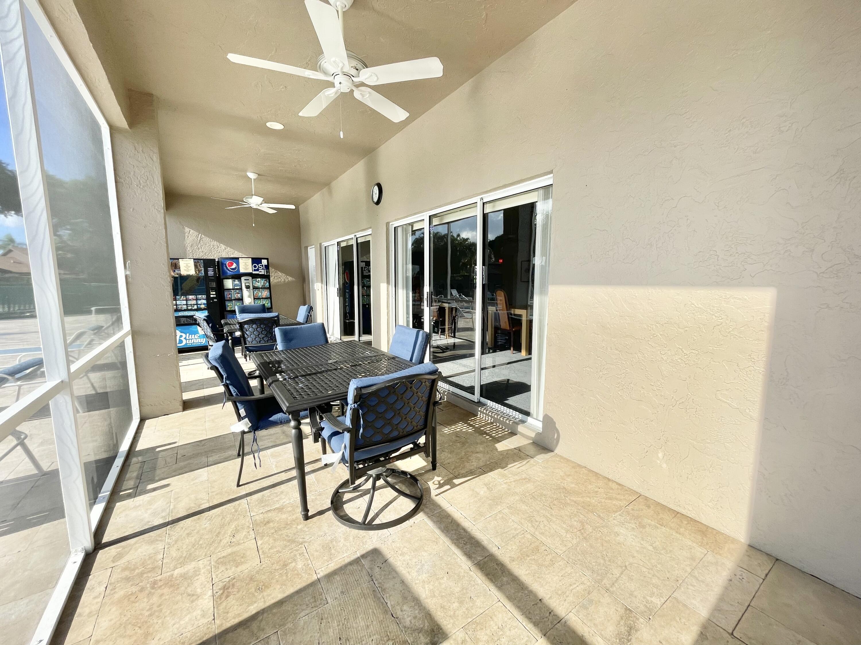 9190 Boca Gardens Parkway, Unit B Boca Raton, FL 33496 - Photo 31 of 35 a workspace with furniture and a table