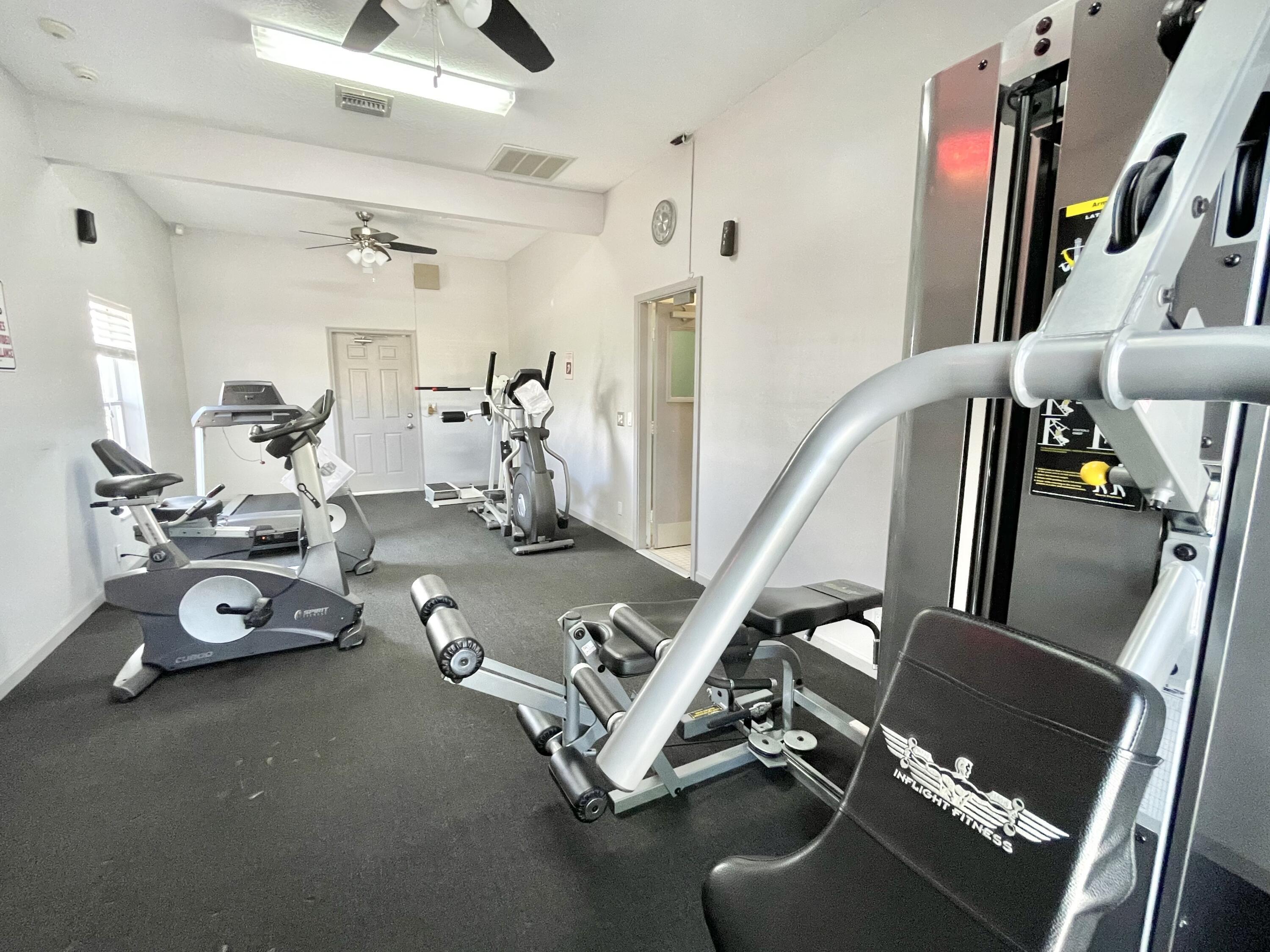 9190 Boca Gardens Parkway, Unit B Boca Raton, FL 33496 - Photo 32 of 35 a view of a room with gym equipment