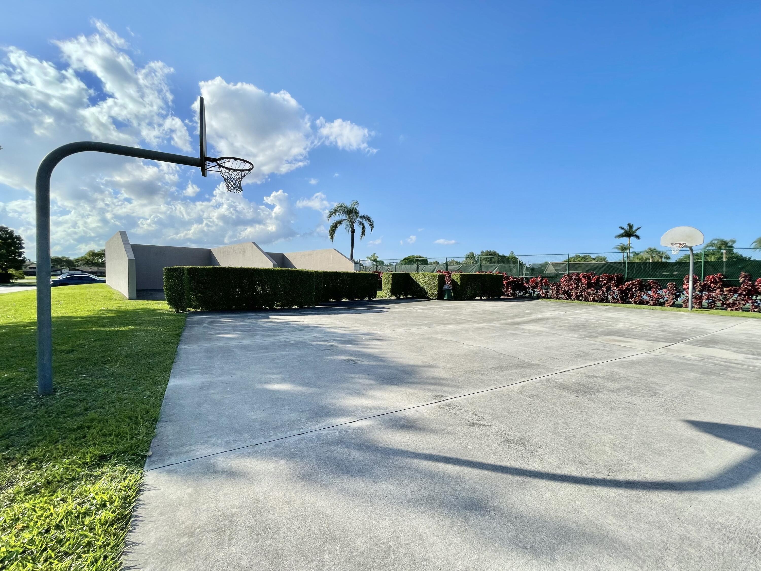 9190 Boca Gardens Parkway, Unit B Boca Raton, FL 33496 - Photo 33 of 35 a front view of a house with a yard