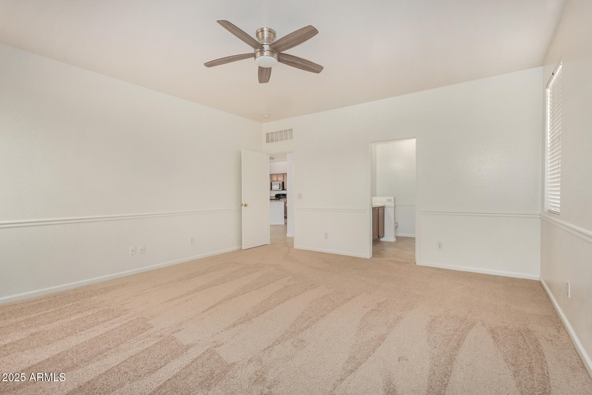 18475 North Madison Road Maricopa, AZ 85139 - Photo 19 of 40 a view of empty room with ceiling fan