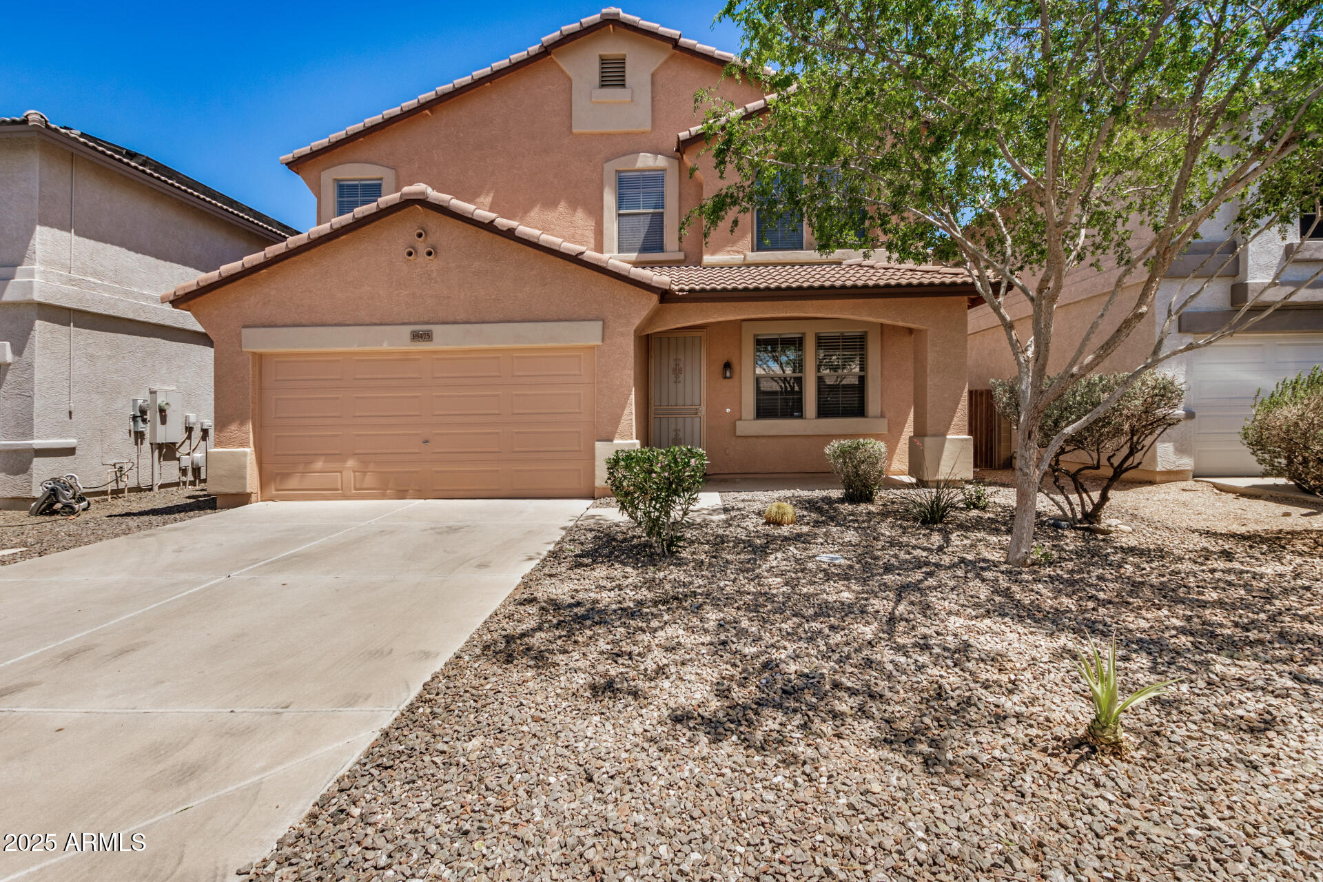 18475 North Madison Road Maricopa, AZ 85139 - Photo 2 of 40 a view of a house with a yard