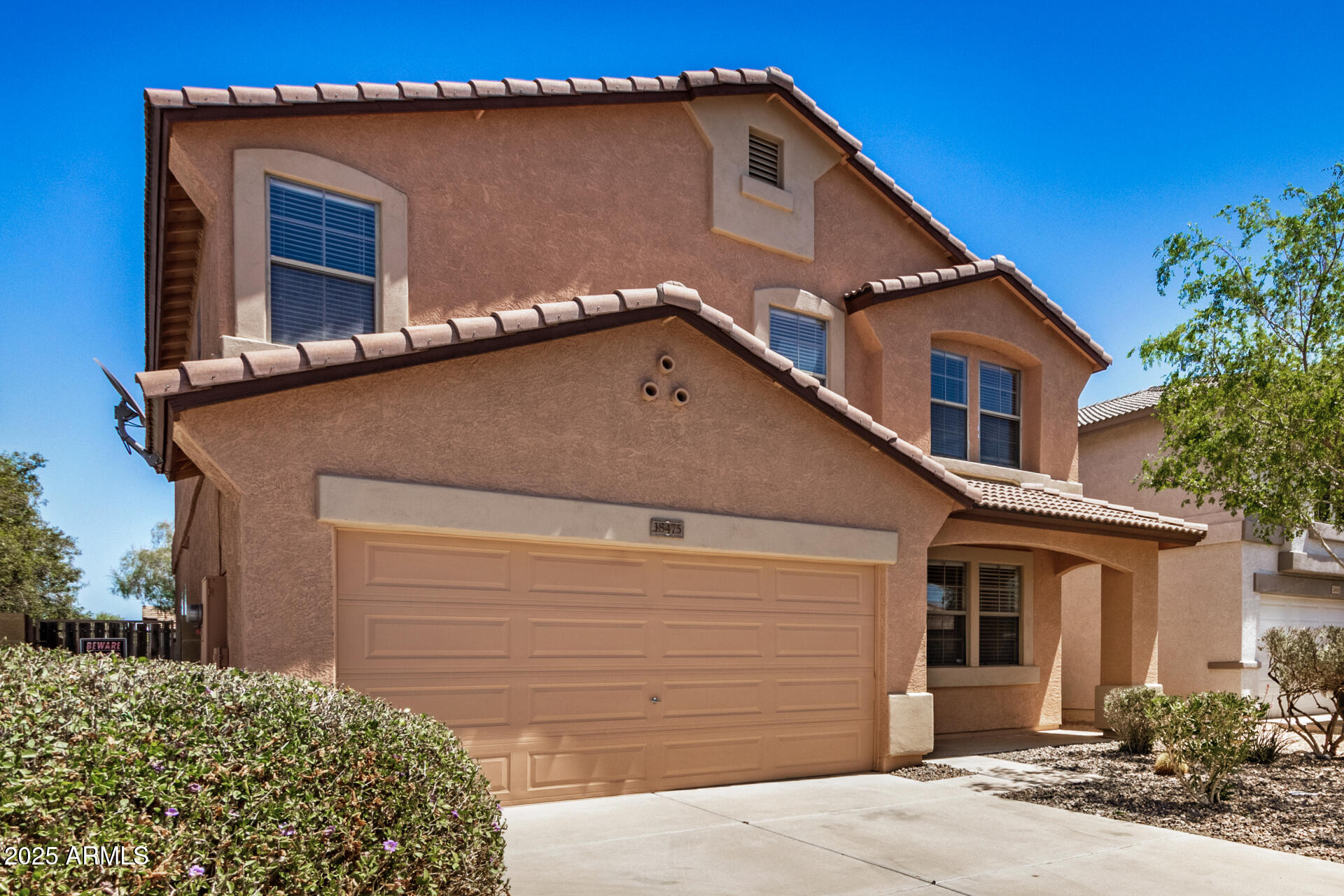 18475 North Madison Road Maricopa, AZ 85139 - Photo 3 of 40 a front view of a house with a garage