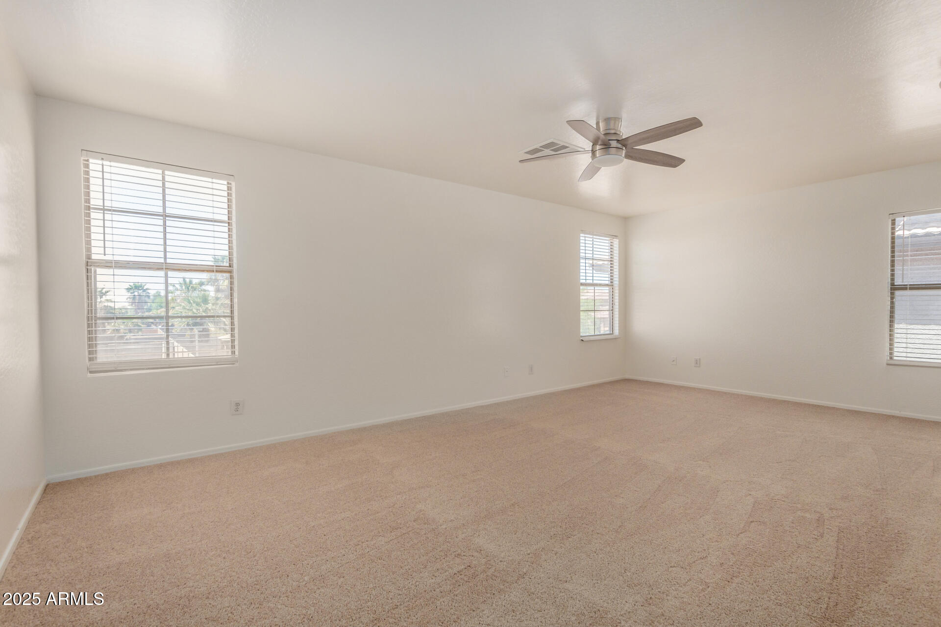18475 North Madison Road Maricopa, AZ 85139 - Photo 31 of 40 an empty room with a window and a fan