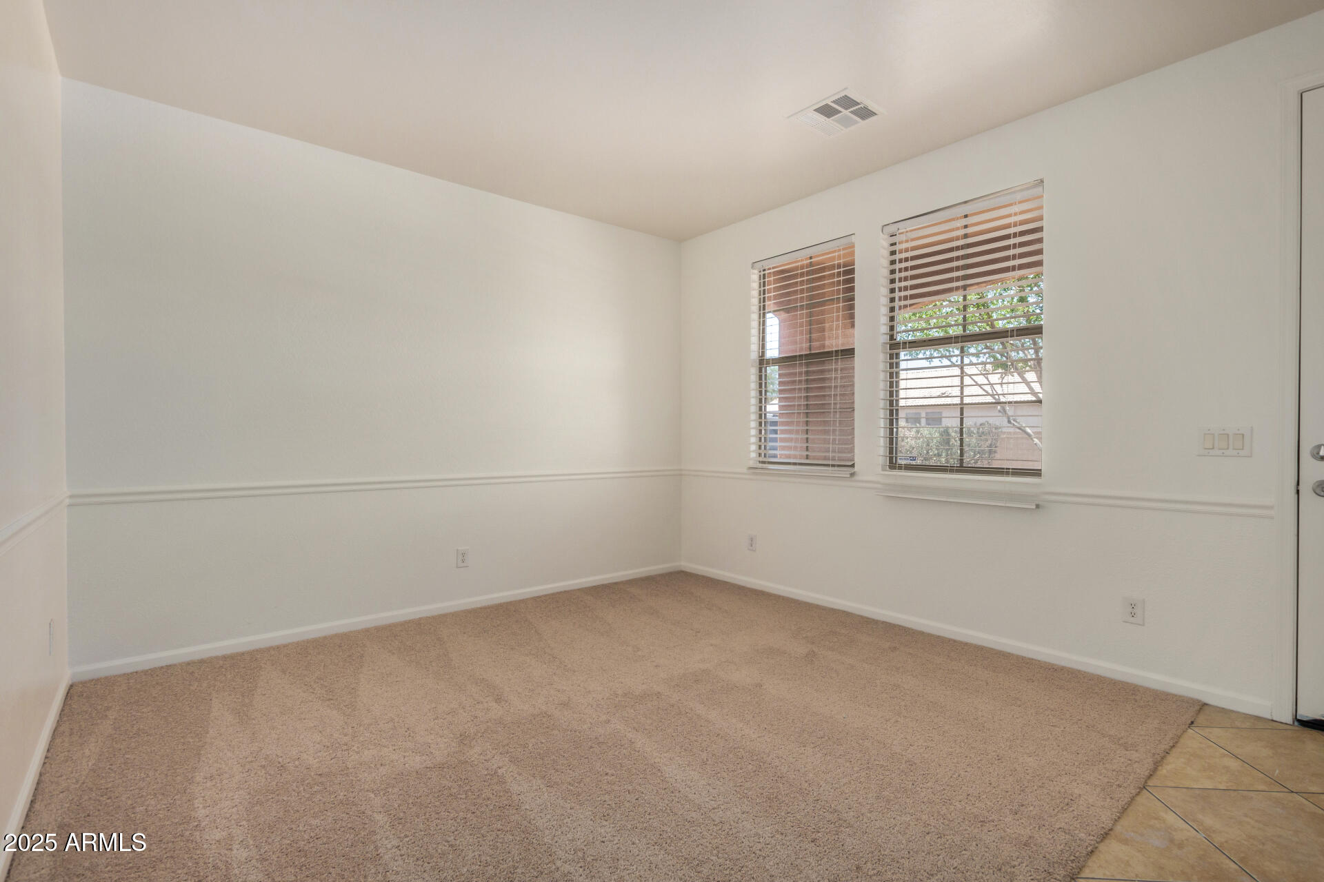 18475 North Madison Road Maricopa, AZ 85139 - Photo 34 of 40 an empty room with a window
