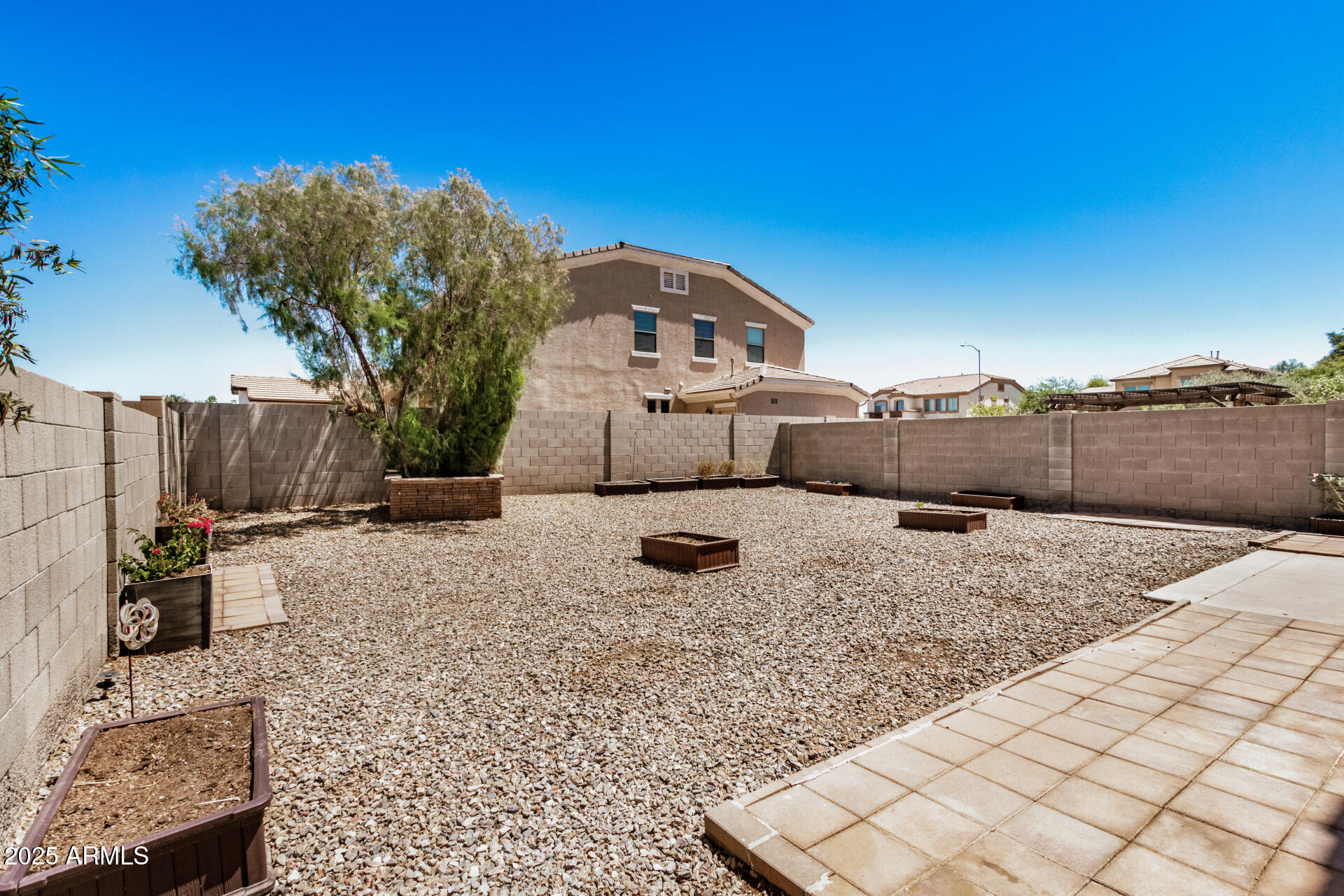 18475 North Madison Road Maricopa, AZ 85139 - Photo 37 of 40 a front view of a house with a yard