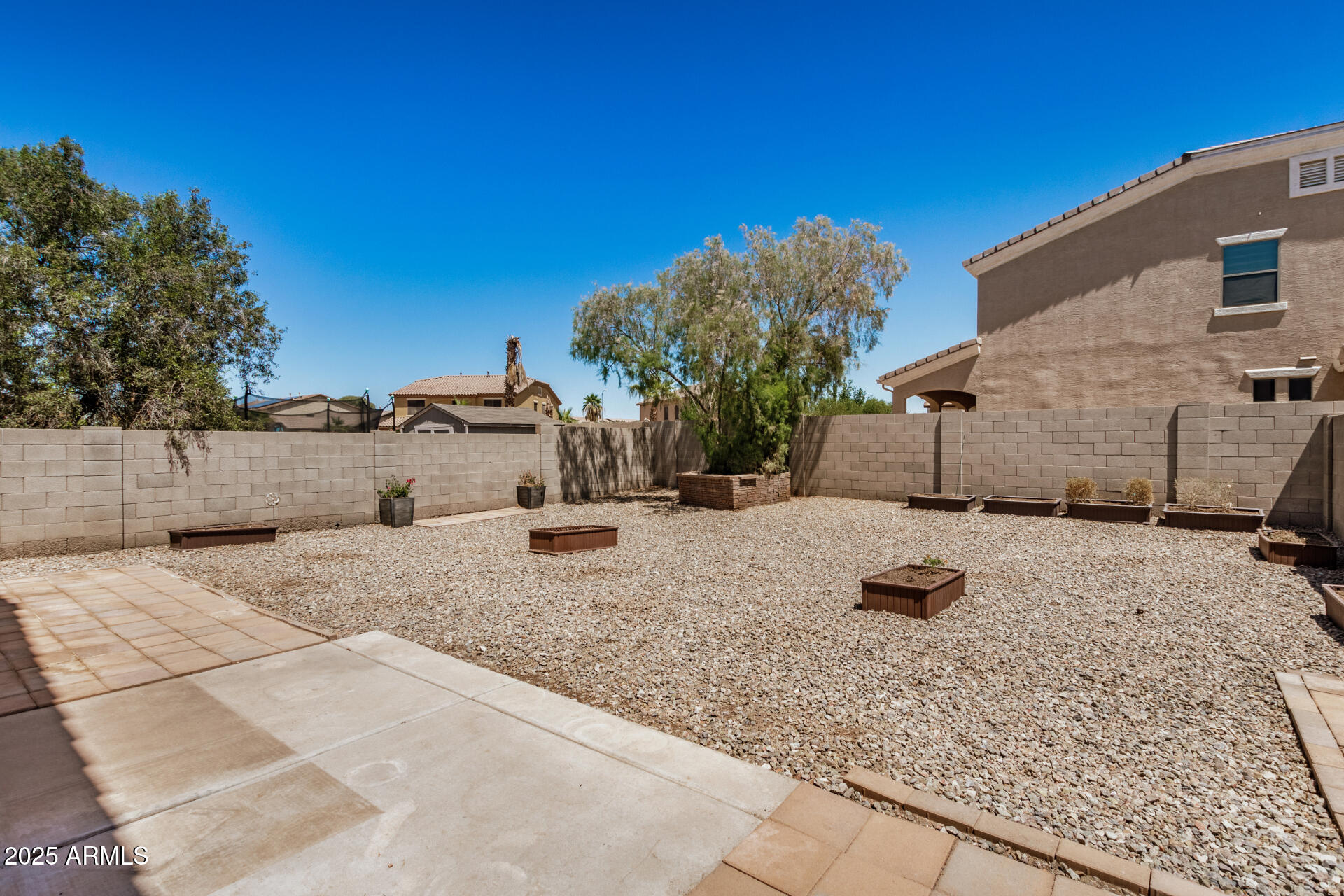 18475 North Madison Road Maricopa, AZ 85139 - Photo 38 of 40 a view of a dry yard with trees