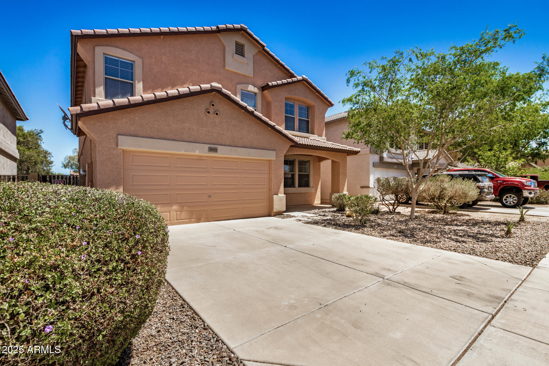 18475 North Madison Road Maricopa, AZ 85139 - Photo 4 of 40 a house view with a outdoor space