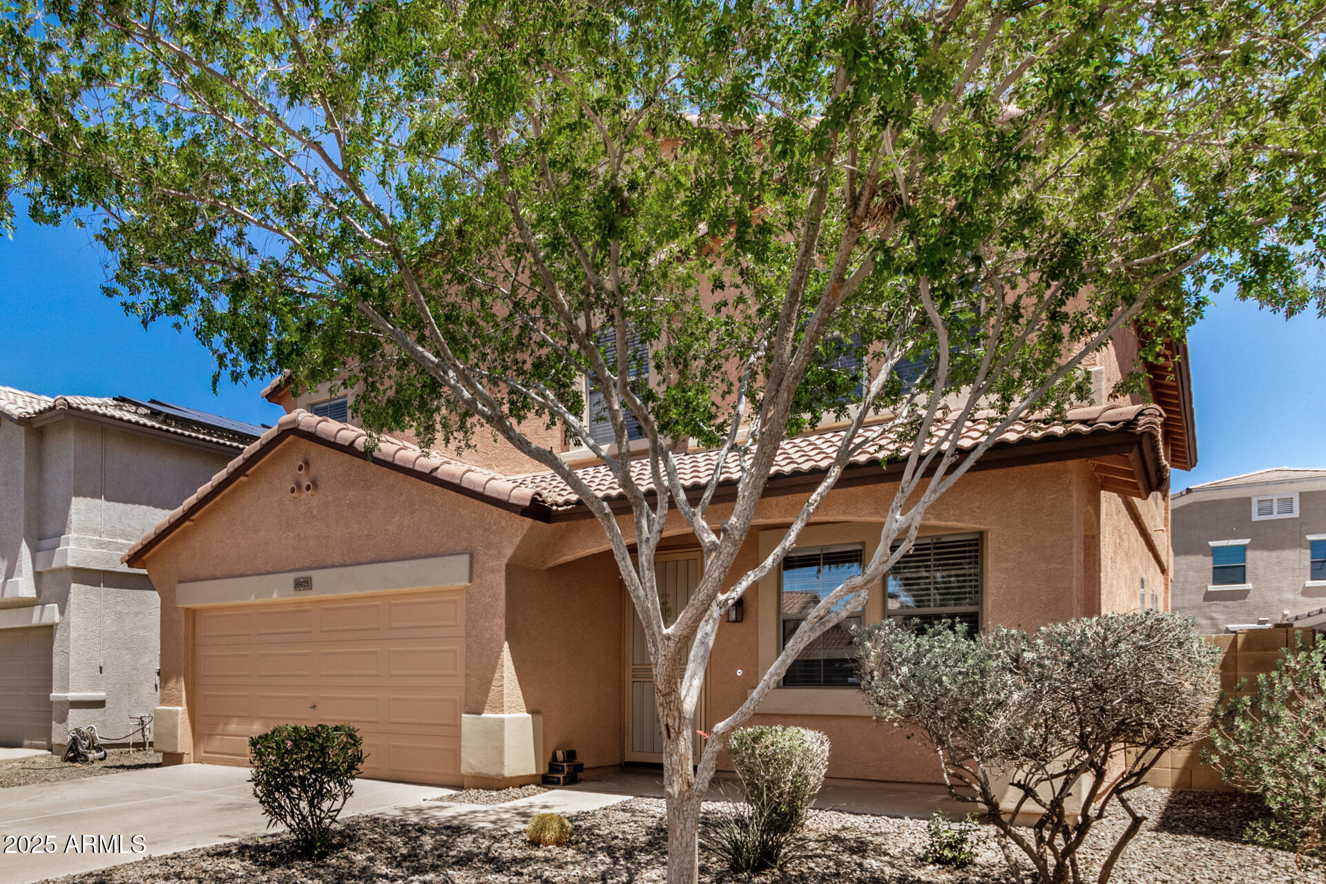 18475 North Madison Road Maricopa, AZ 85139 - Photo 5 of 40 a front view of a house with garden