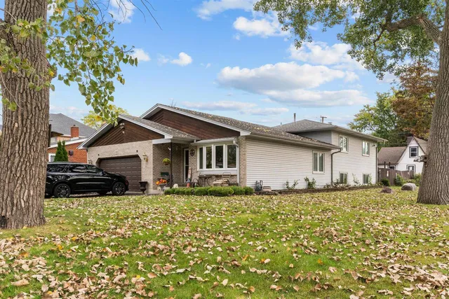 a house that has a tree in front of it