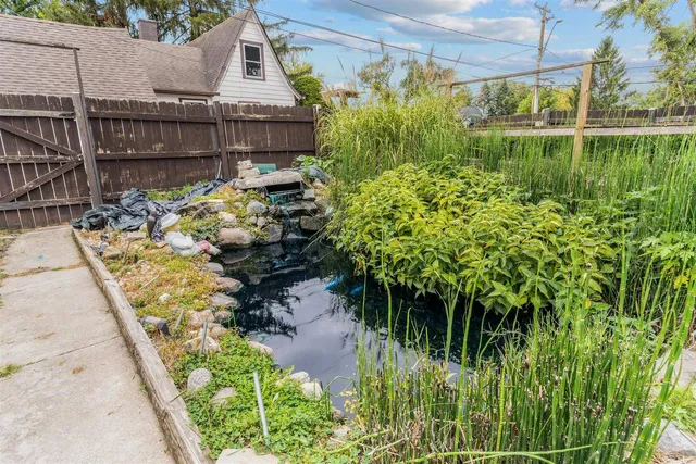 a backyard of a house with lots of green space