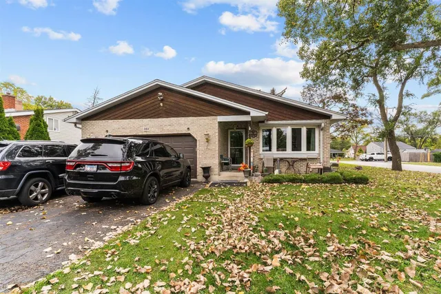 a view of a car parked in front of a house