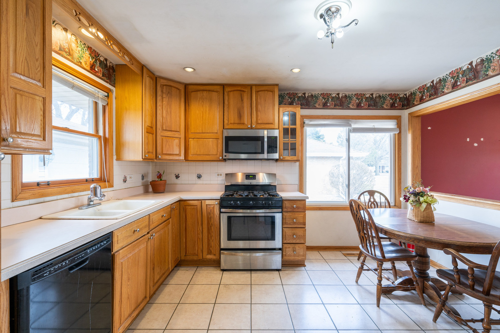 5912 109th Place Chicago Ridge, IL 60415 - Photo 12 of 21 a kitchen with a stove a sink and a refrigerator