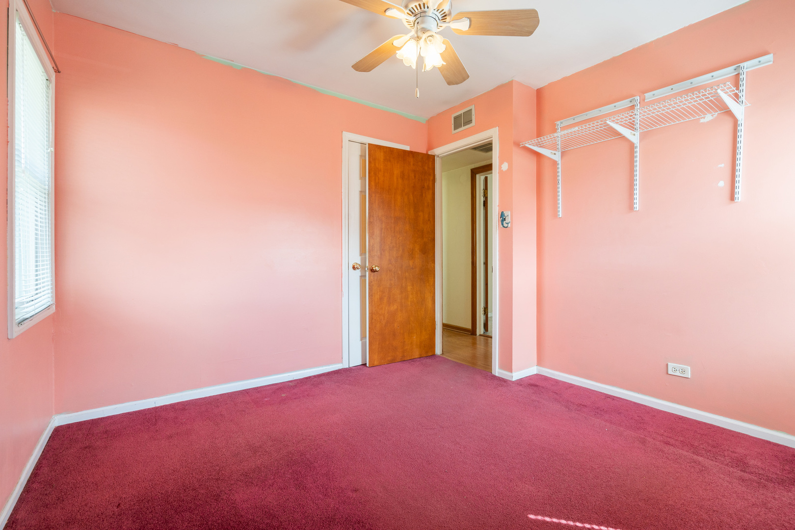 5912 109th Place Chicago Ridge, IL 60415 - Photo 15 of 21 an empty room with a ceiling fan and a window