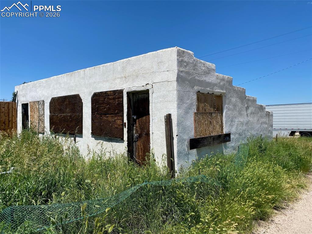 344 3rd Street Calhan, CO 80808 - Photo 1 of 5 a view of a house with a yard