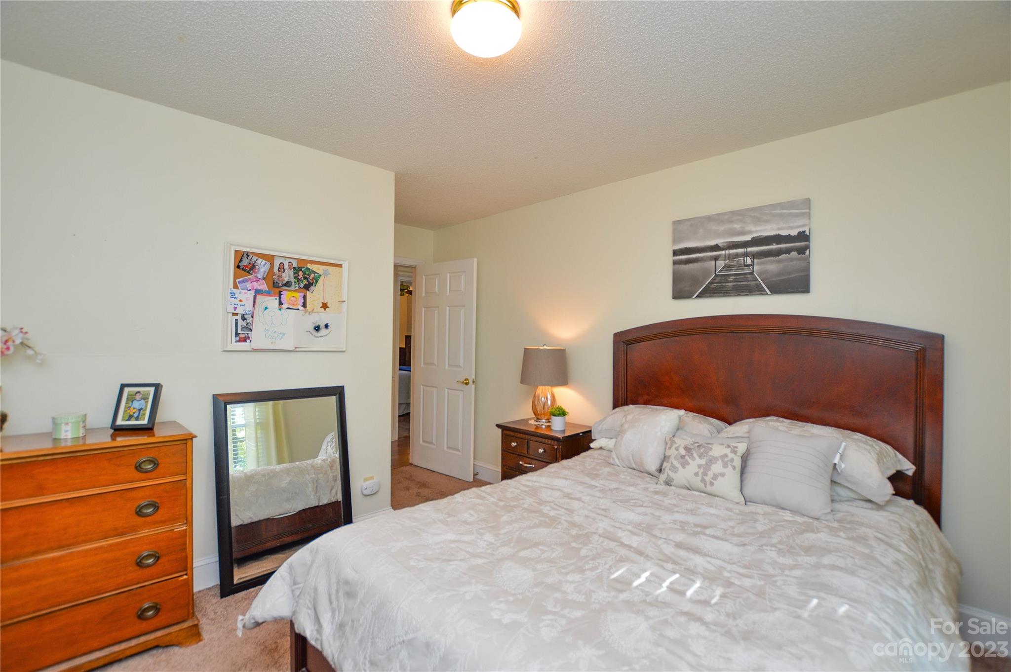 5215 Rocky River Road Charlotte, NC 28215 - Photo 17 of 33 a bedroom with a bed and a dresser