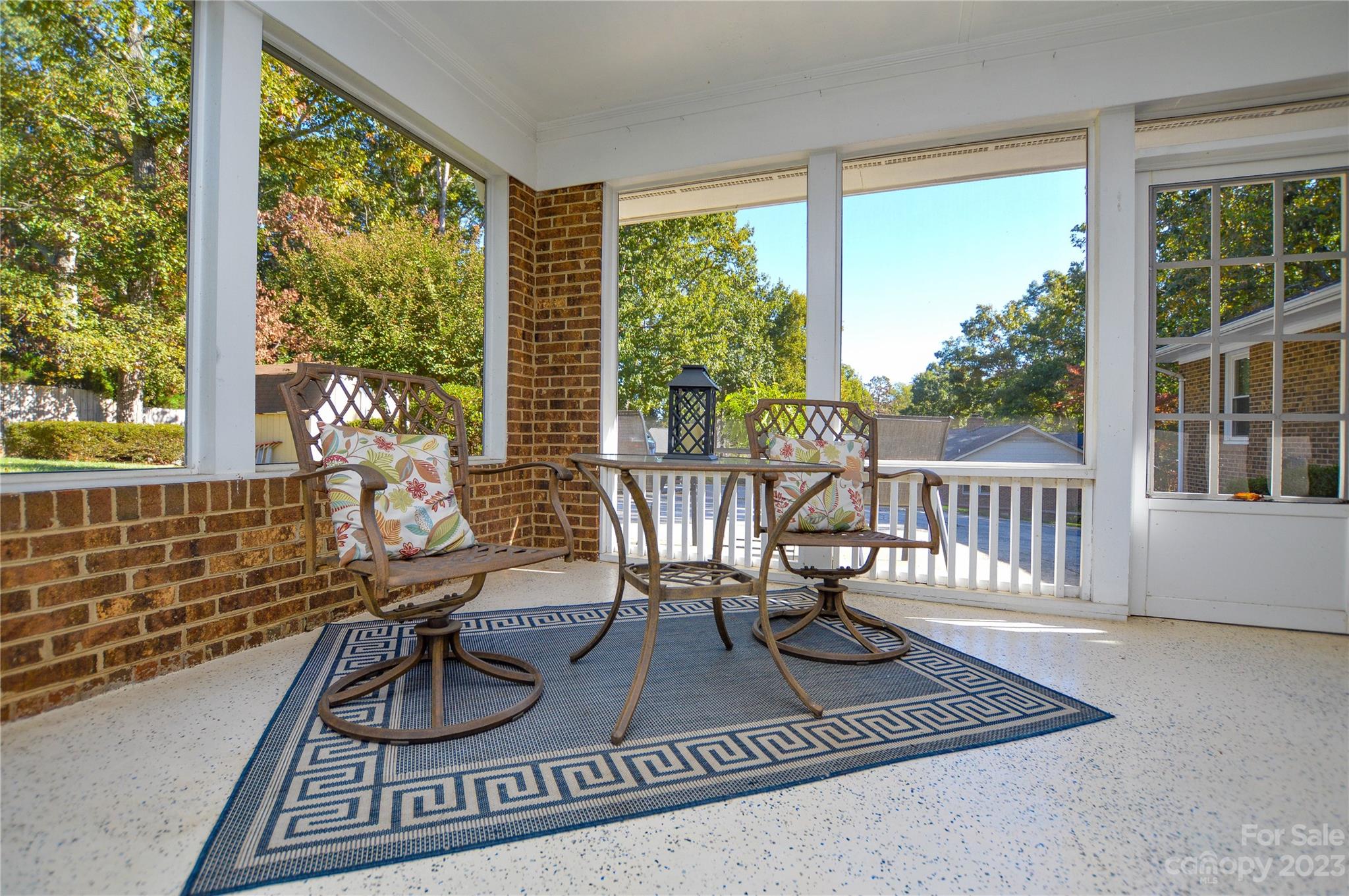 5215 Rocky River Road Charlotte, NC 28215 - Photo 31 of 33 a living room with furniture floor to ceiling window and wooden floor