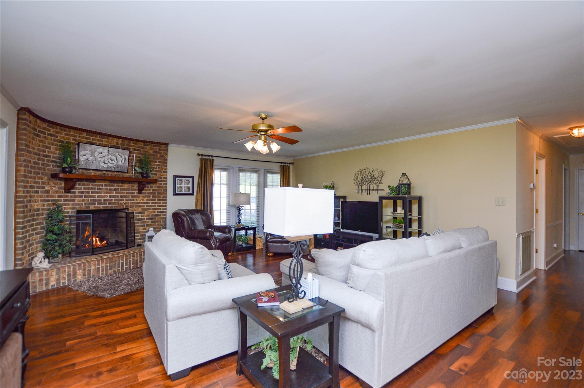 5215 Rocky River Road Charlotte, NC 28215 - Photo 5 of 33 a living room with furniture and a fireplace