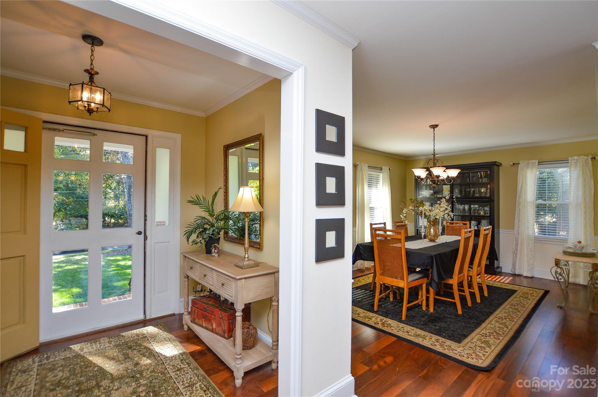 5215 Rocky River Road Charlotte, NC 28215 - Photo 9 of 33 a view of a dining room with furniture window and wooden floor