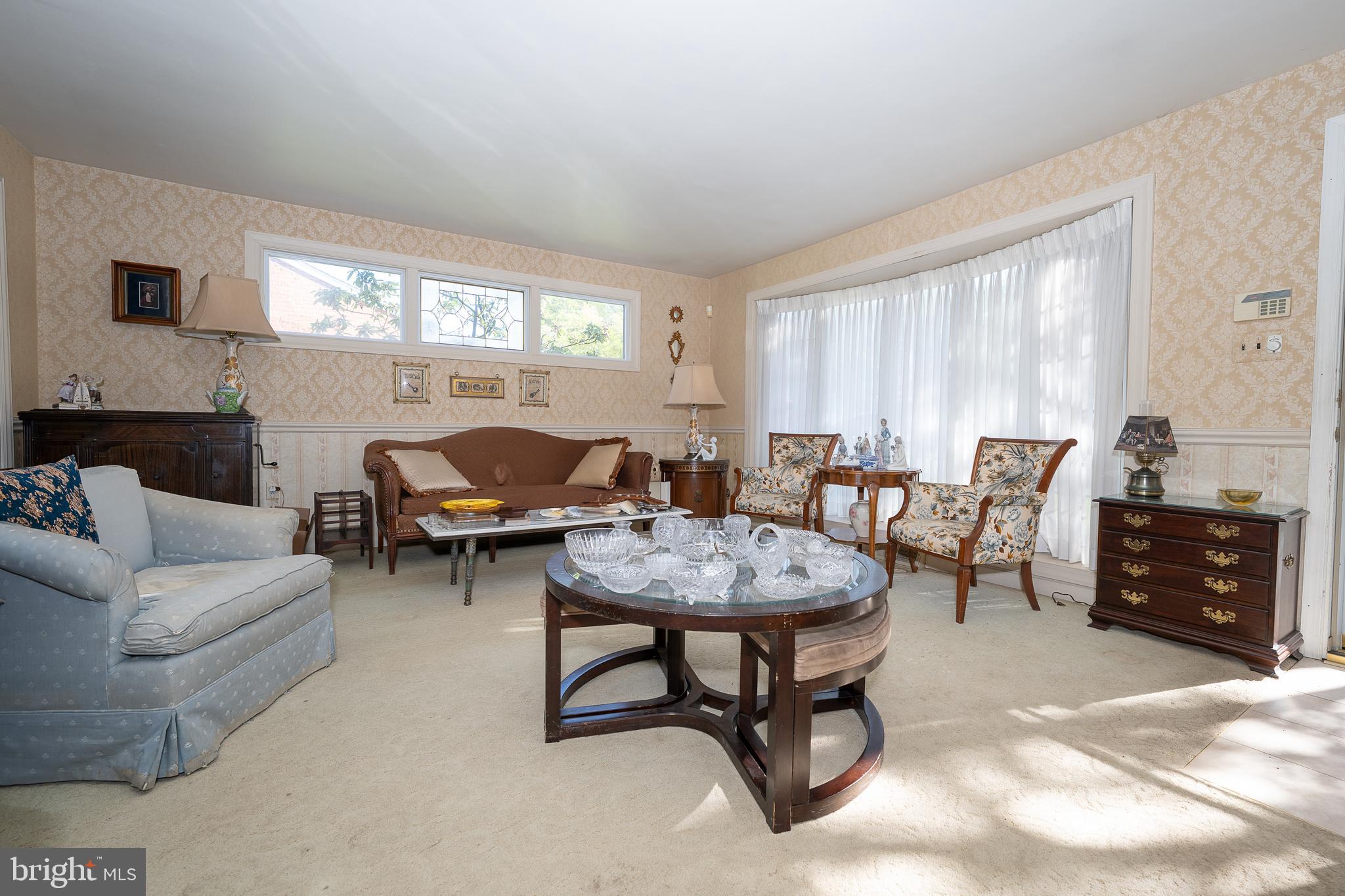 262 Lewis Road Springfield, PA 19064 - Photo 3 of 11 a living room with furniture and a window