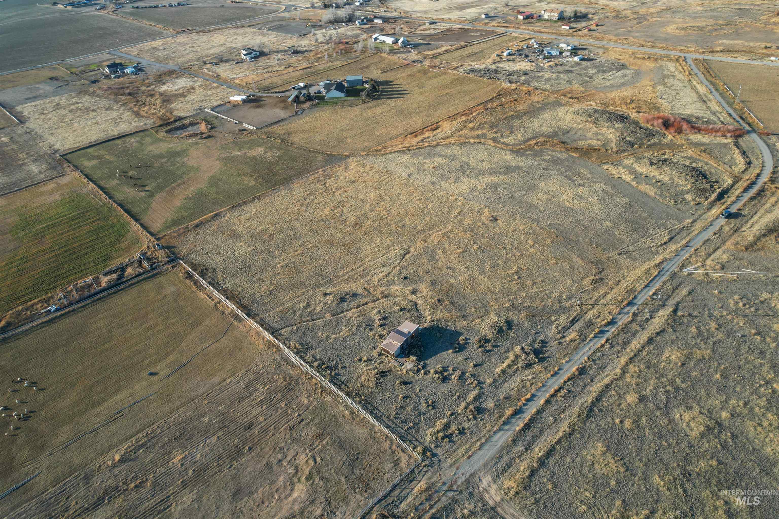 171 East 552 North Shoshone, ID 83352 - Photo 13 of 18 Aerial view of property and surrounding area featuring rural landscape