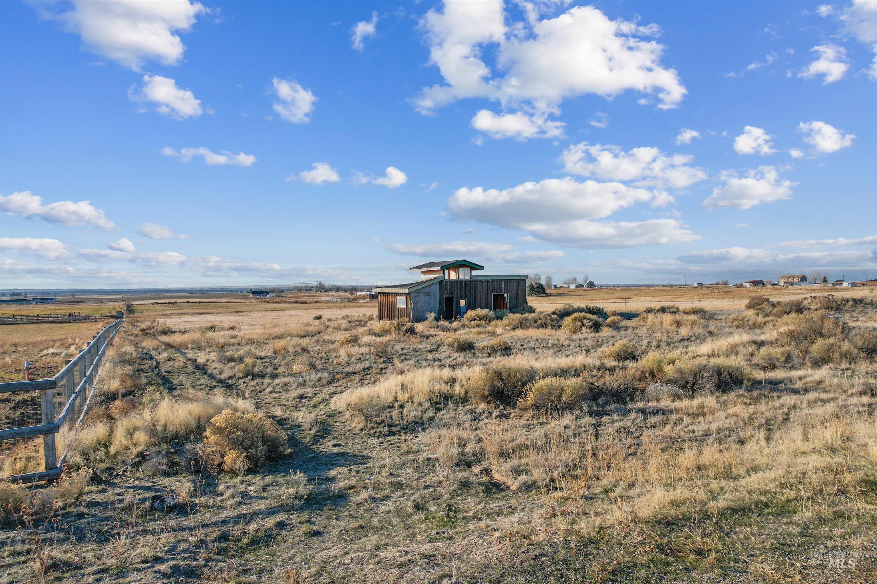 171 East 552 North Shoshone, ID 83352 - Photo 7 of 18 View of yard with a view of countryside, an outbuilding, and a pole building