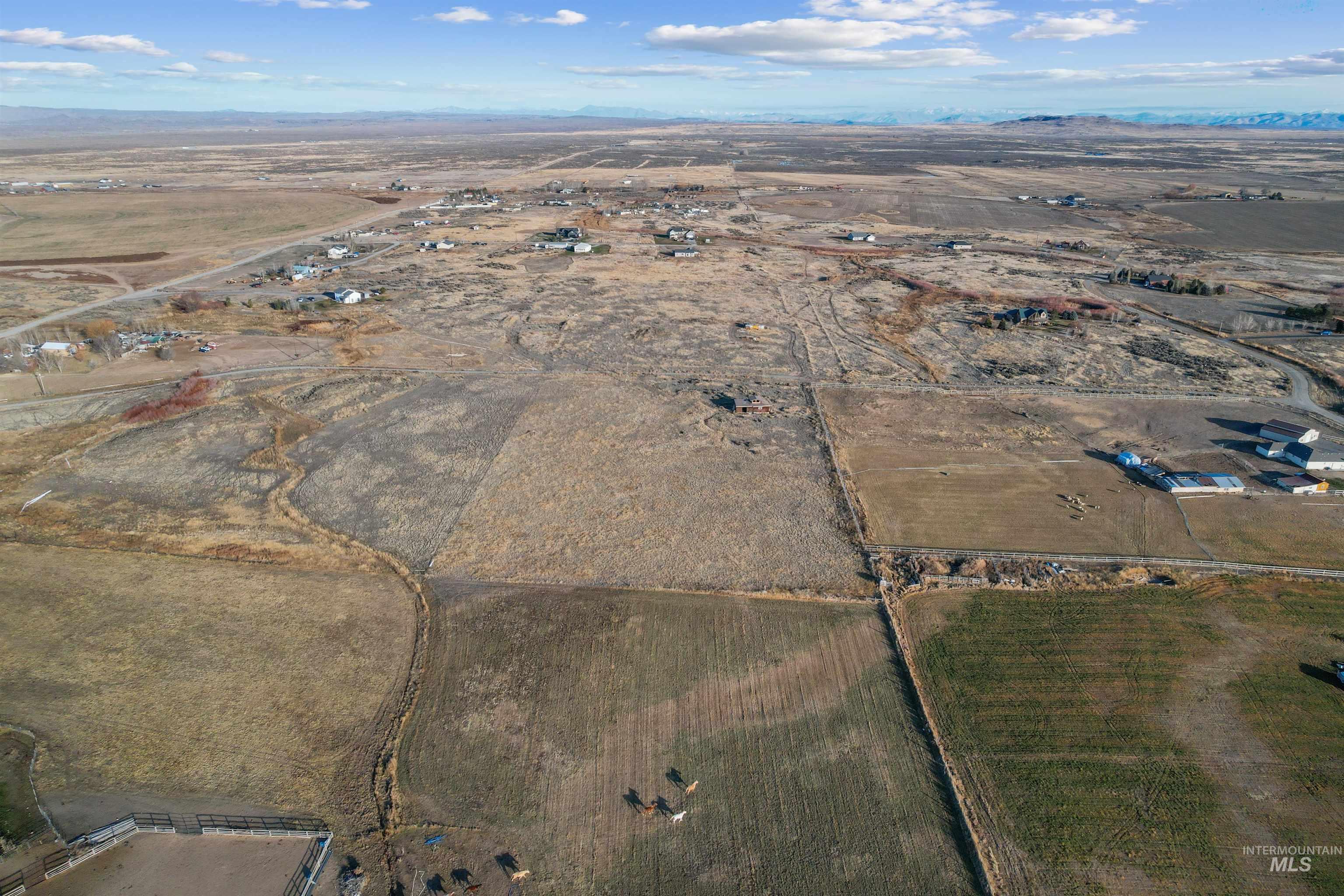 171 East 552 North Shoshone, ID 83352 - Photo 9 of 18 Aerial view of property and surrounding area with rural landscape and a desert landscape