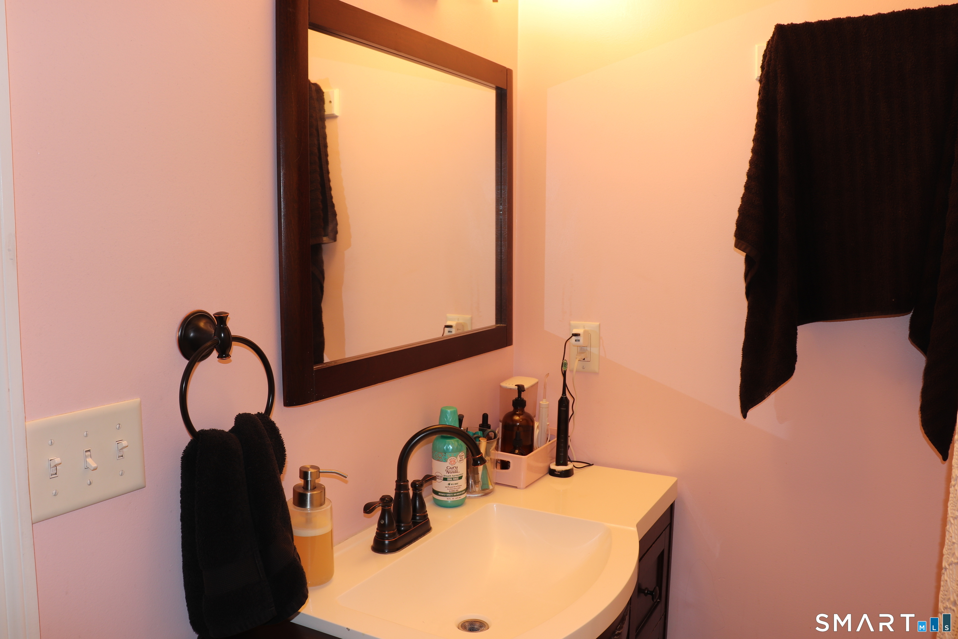308 Abbe Road Enfield, CT 06082 - Photo 25 of 33 a bathroom with a sink and a mirror