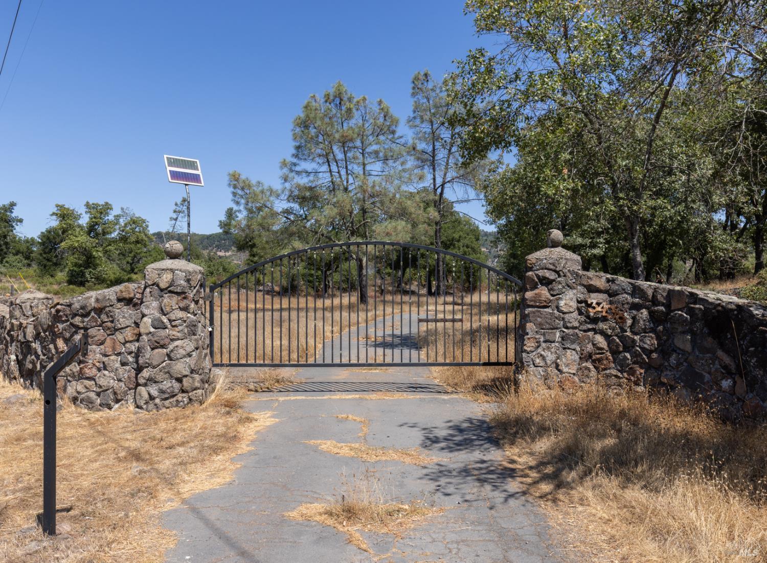 a view of a wrought iron fences in front of house