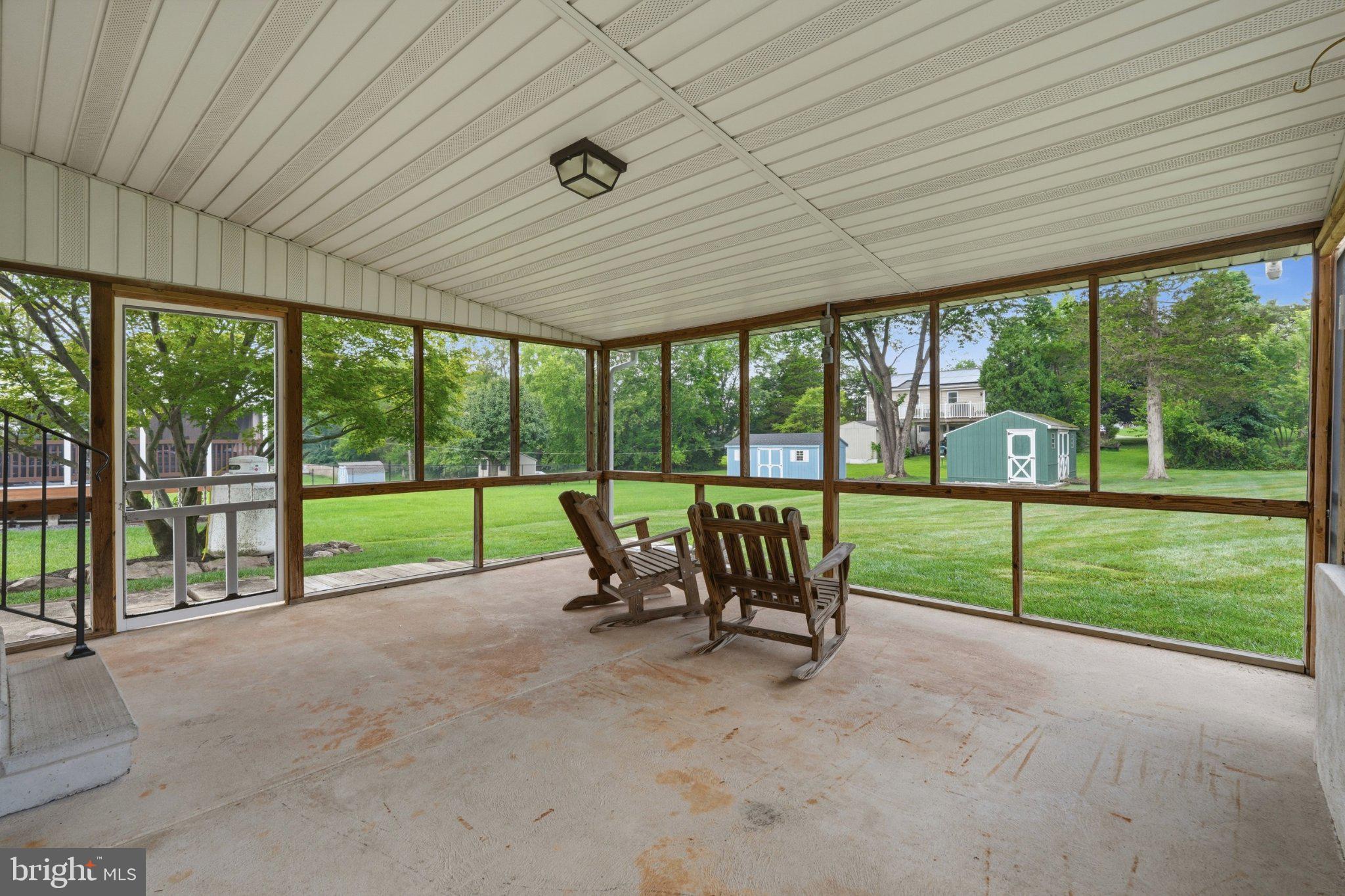 1385 Woodmere Road Pottstown, PA 19464 - Photo 39 of 63 Serene screened porch with lush views.
