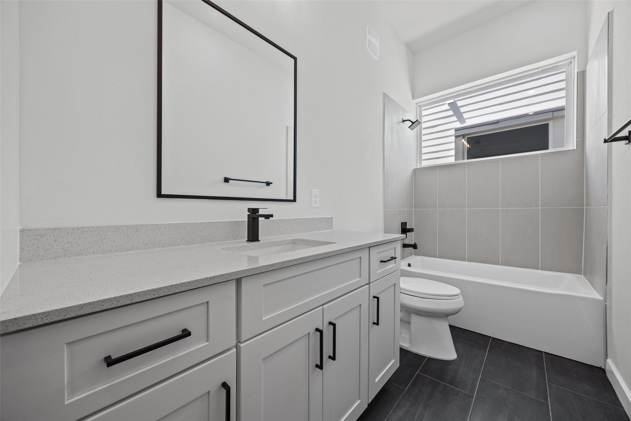2000 Riverside Farms Road, Unit 5102 Austin, TX 78741 - Photo 21 of 25 A well-appointed bathroom with contemporary fixtures, including a clean vanity and a tiled bath area.