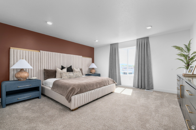 2819 South 710th West, Unit 14 Logan, UT 84321 - Photo 16 of 24 Carpeted room featuring a large window, recessed lighting, and a painted accent wall