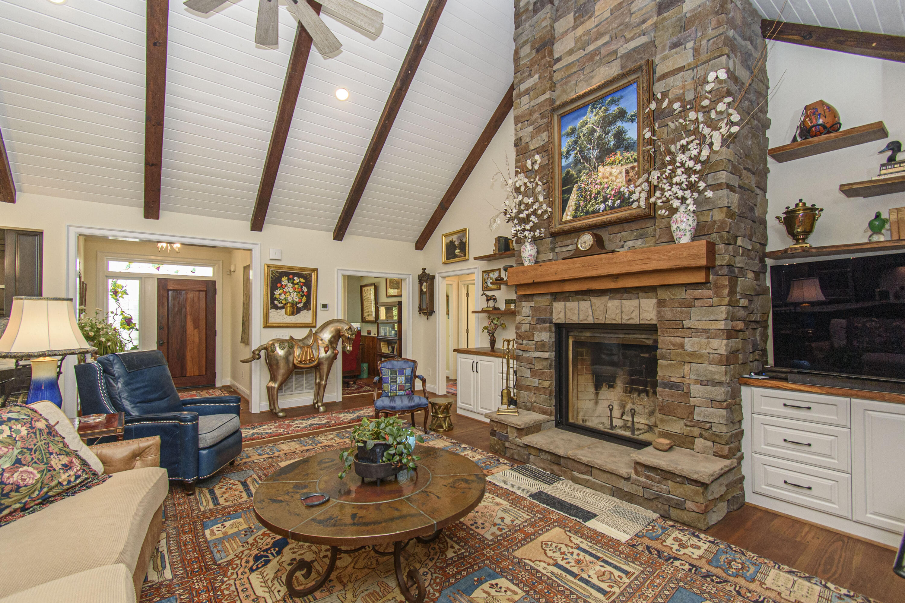 5600 Mt Tabor Road Blacksburg, VA 24060 - Photo 12 of 99 a living room with furniture a fireplace and a flat screen tv