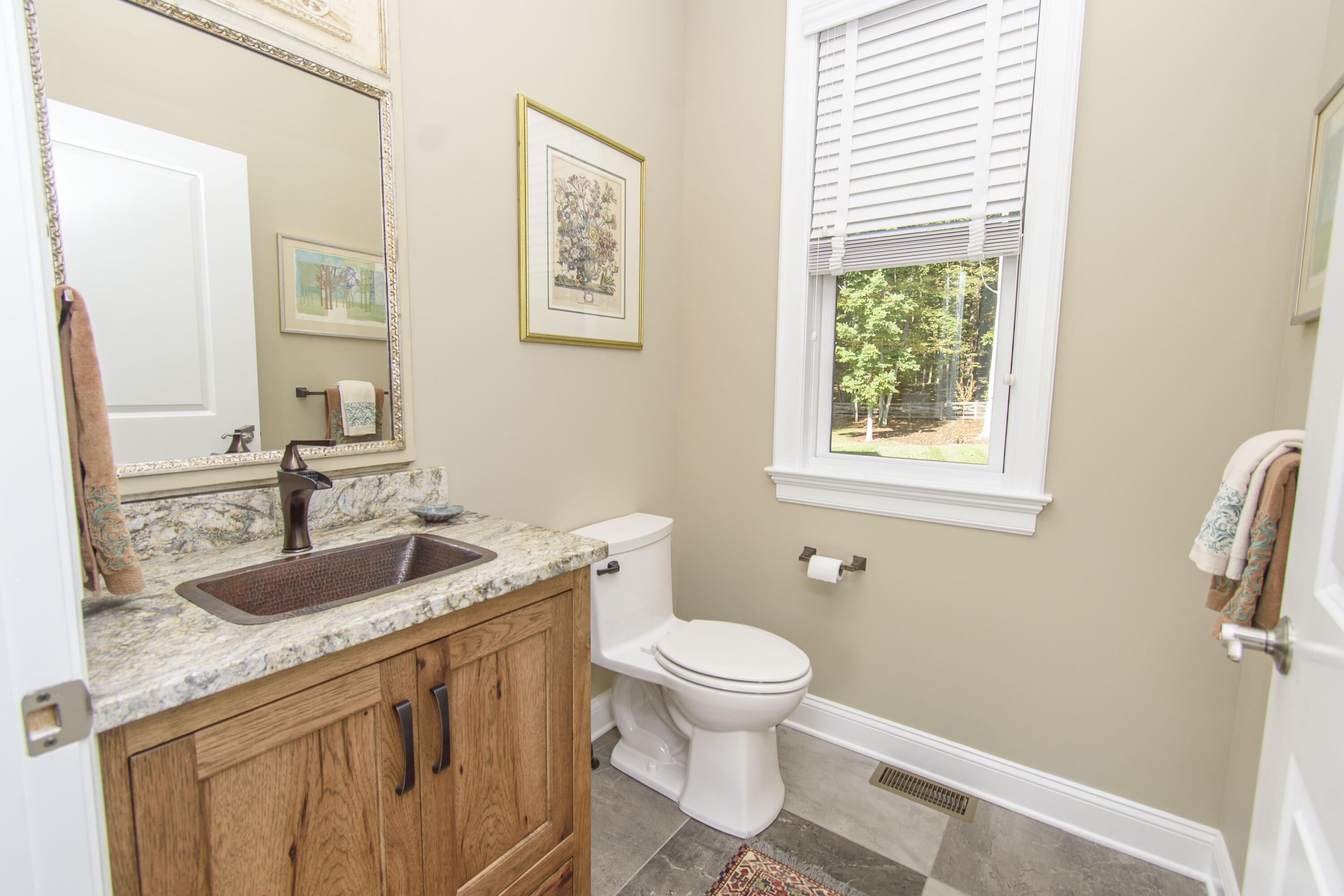 5600 Mt Tabor Road Blacksburg, VA 24060 - Photo 26 of 99 a bathroom with a granite countertop toilet a sink and a mirror