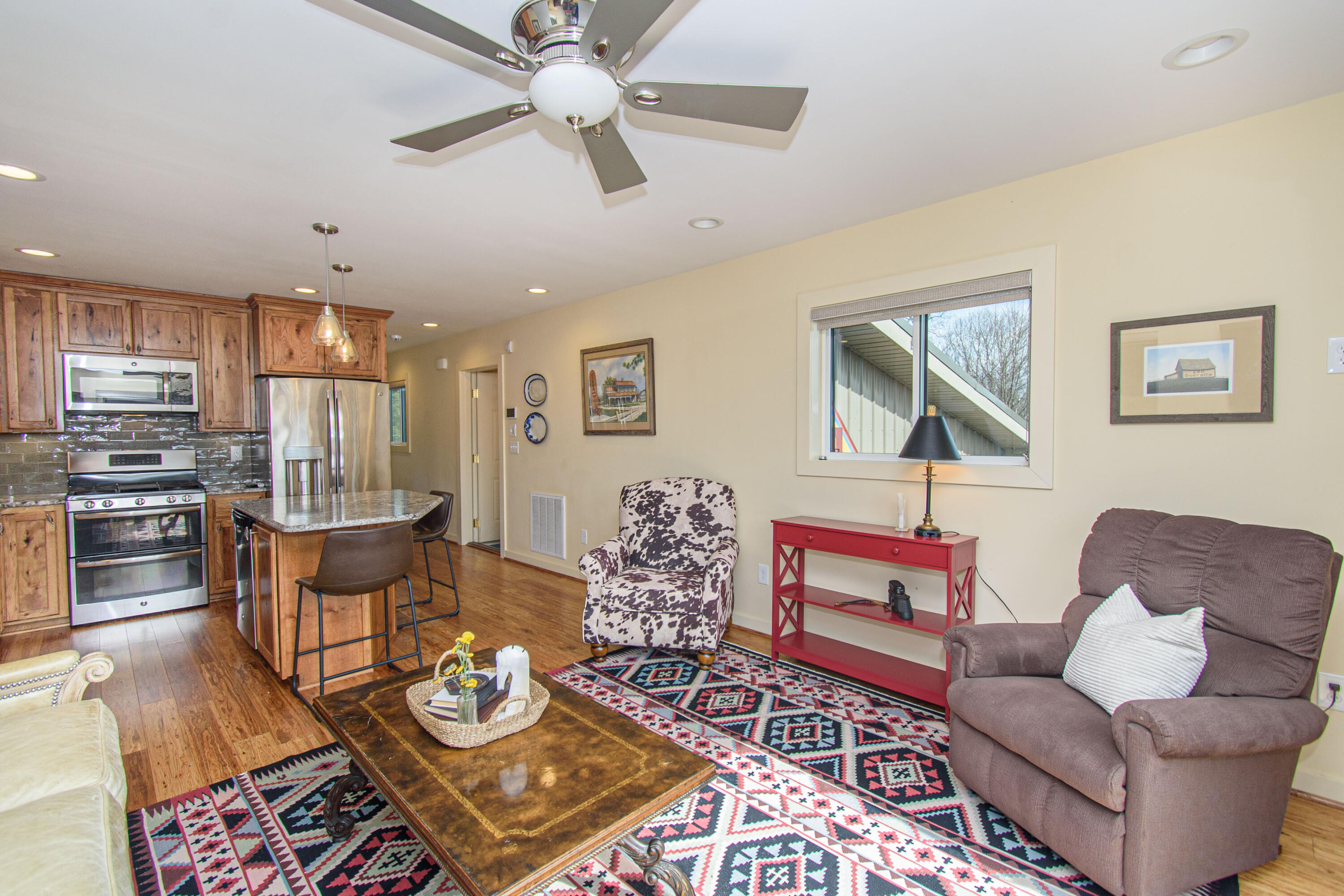 5600 Mt Tabor Road Blacksburg, VA 24060 - Photo 62 of 99 a living room with furniture kitchen view and a wooden floor