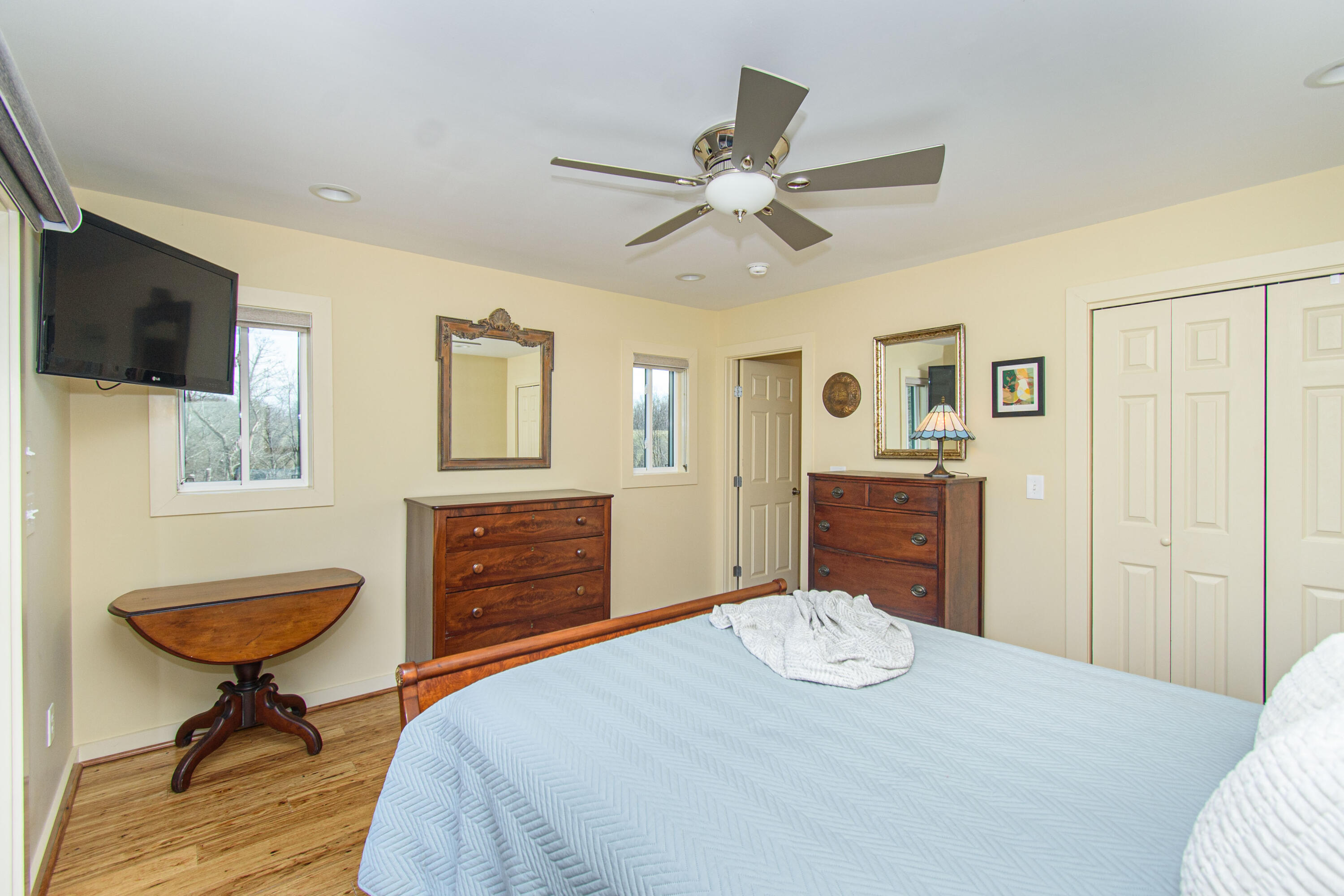 5600 Mt Tabor Road Blacksburg, VA 24060 - Photo 70 of 99 a bedroom with a bed and a chandelier