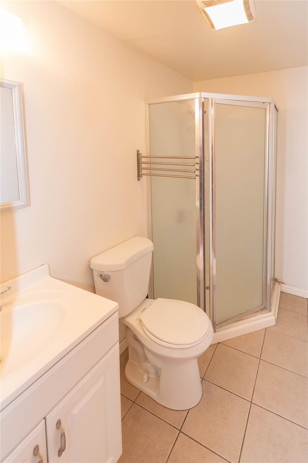 57 East Rock Cut Road Walden, NY 12586 - Photo 14 of 27 Bathroom featuring tile patterned floors, a shower stall, vanity, and toilet