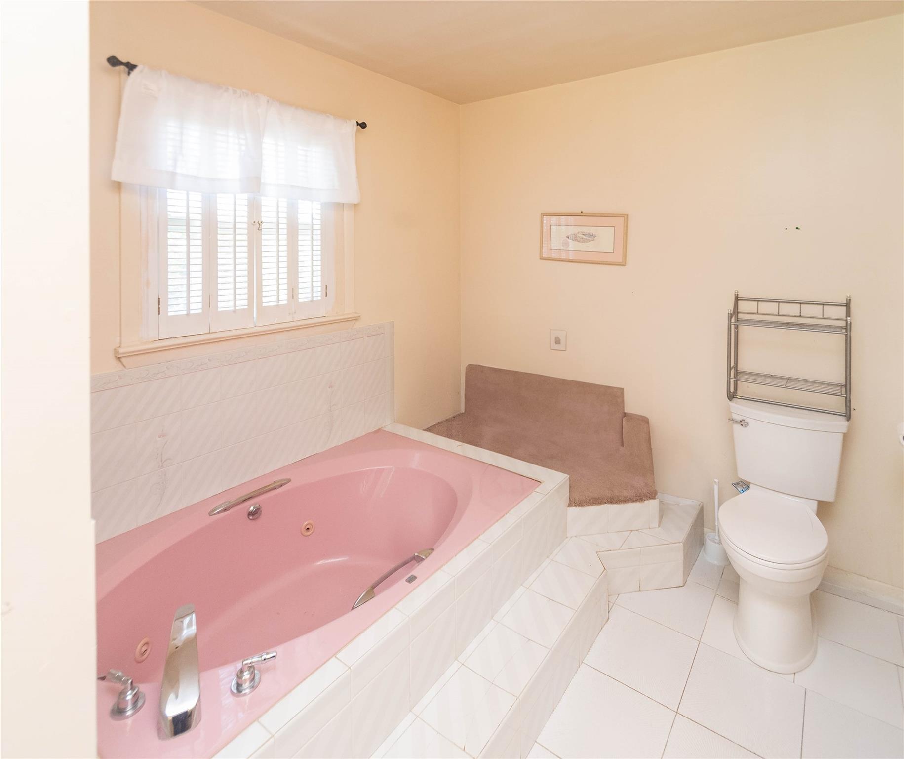 57 East Rock Cut Road Walden, NY 12586 - Photo 17 of 27 Bathroom featuring a whirlpool tub, tile patterned flooring, and toilet