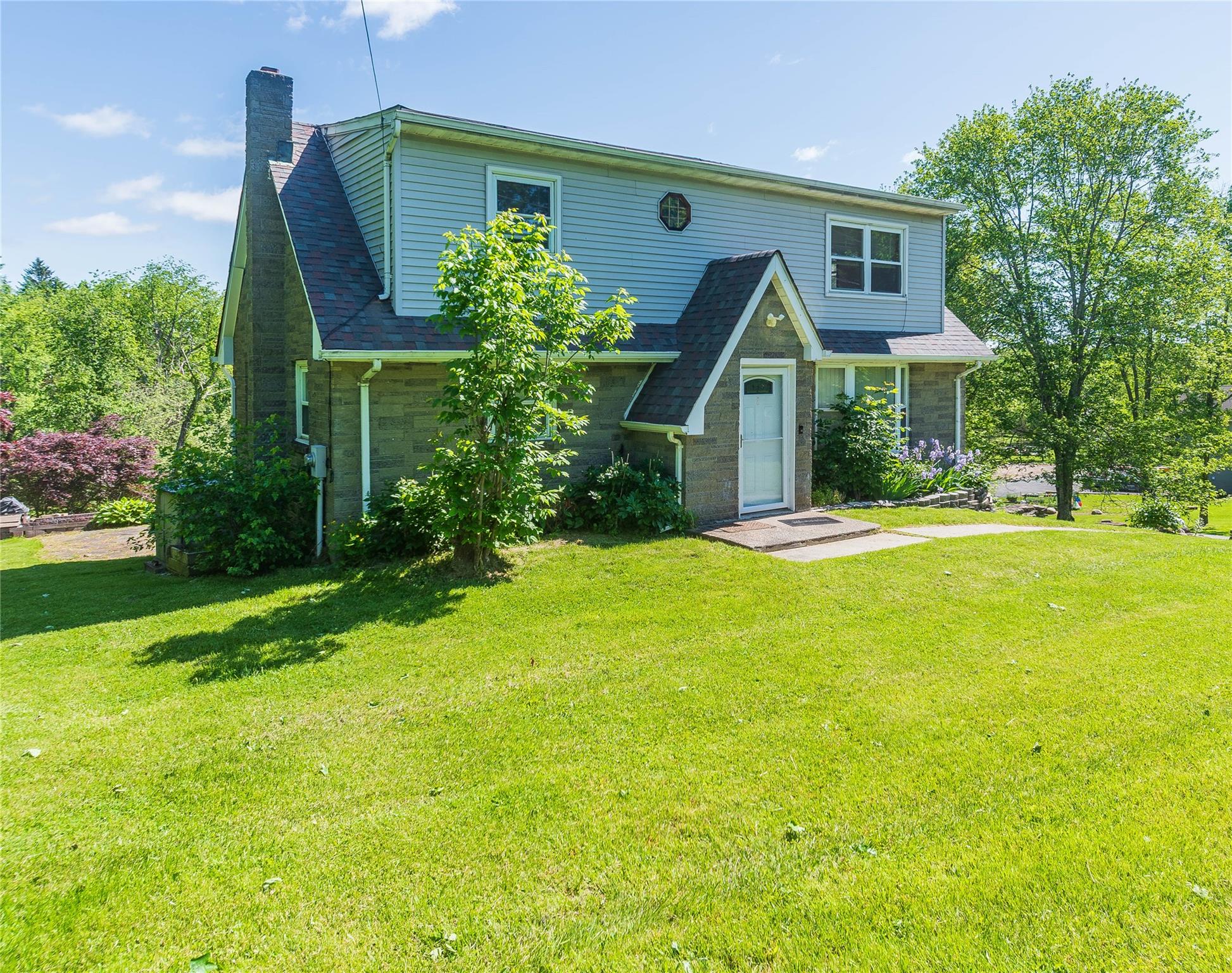 57 East Rock Cut Road Walden, NY 12586 - Photo 27 of 27 View of front of house featuring a chimney, a front yard, and a shingled roof