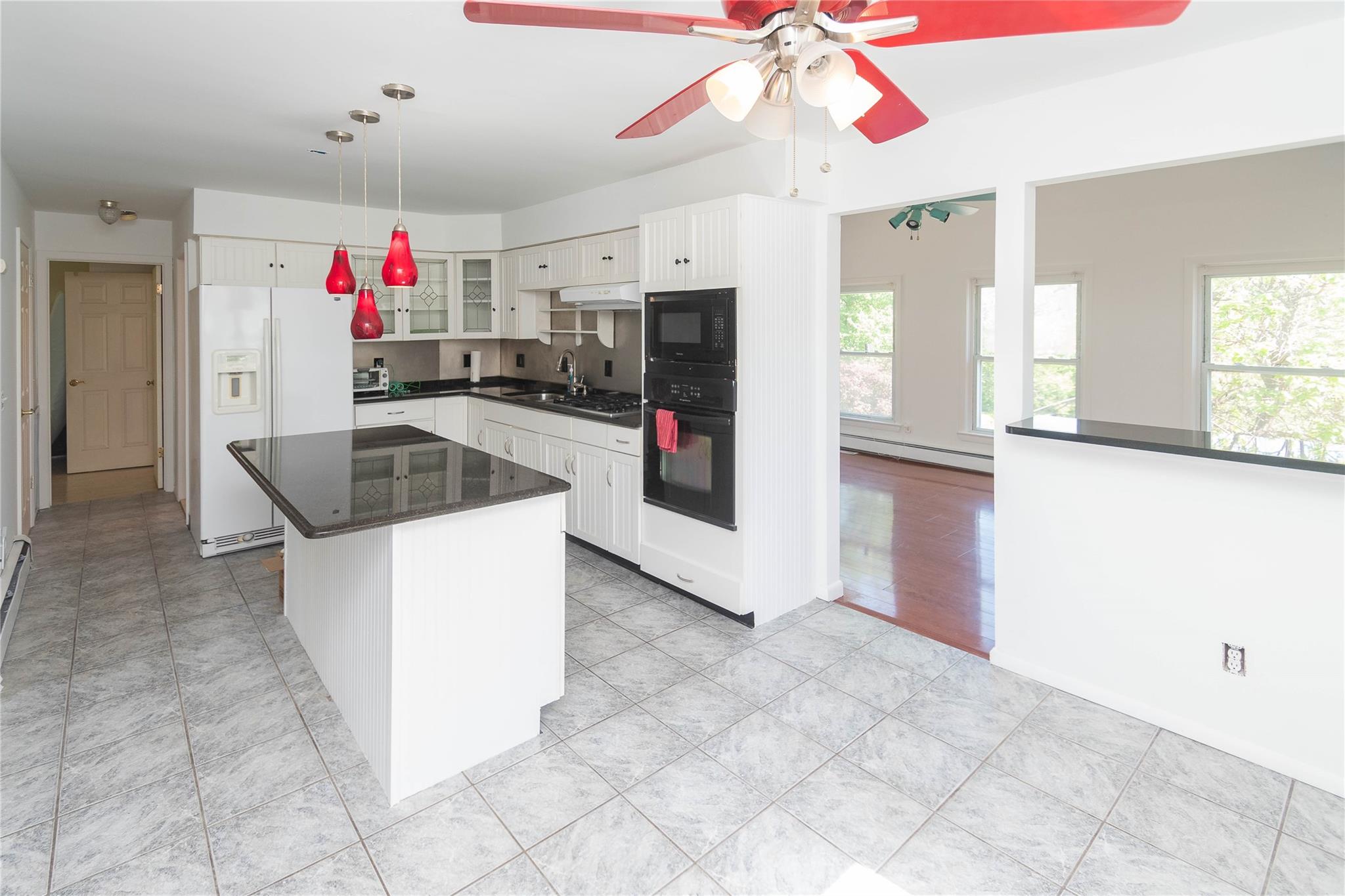 57 East Rock Cut Road Walden, NY 12586 - Photo 3 of 27 Kitchen featuring black appliances, plenty of natural light, glass insert cabinets, and a ceiling fan