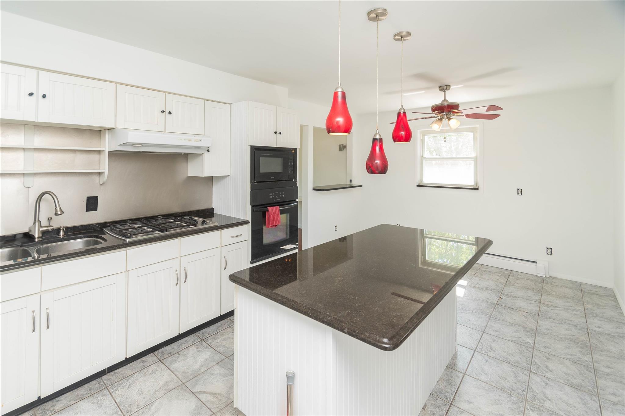57 East Rock Cut Road Walden, NY 12586 - Photo 4 of 27 Kitchen with black appliances, a sink, under cabinet range hood, ceiling fan, and white cabinets