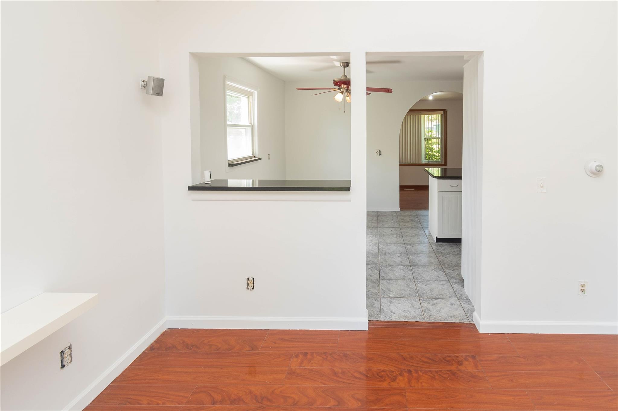 57 East Rock Cut Road Walden, NY 12586 - Photo 9 of 27 Spare room with ceiling fan, plenty of natural light, arched walkways, and baseboards