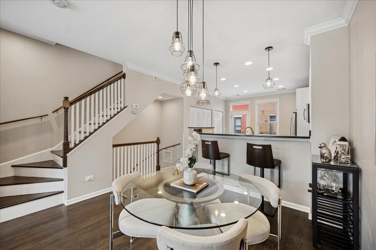 634 West Oak Street Chicago, IL 60610 - Photo 14 of 34 a dining room with furniture and wooden floor