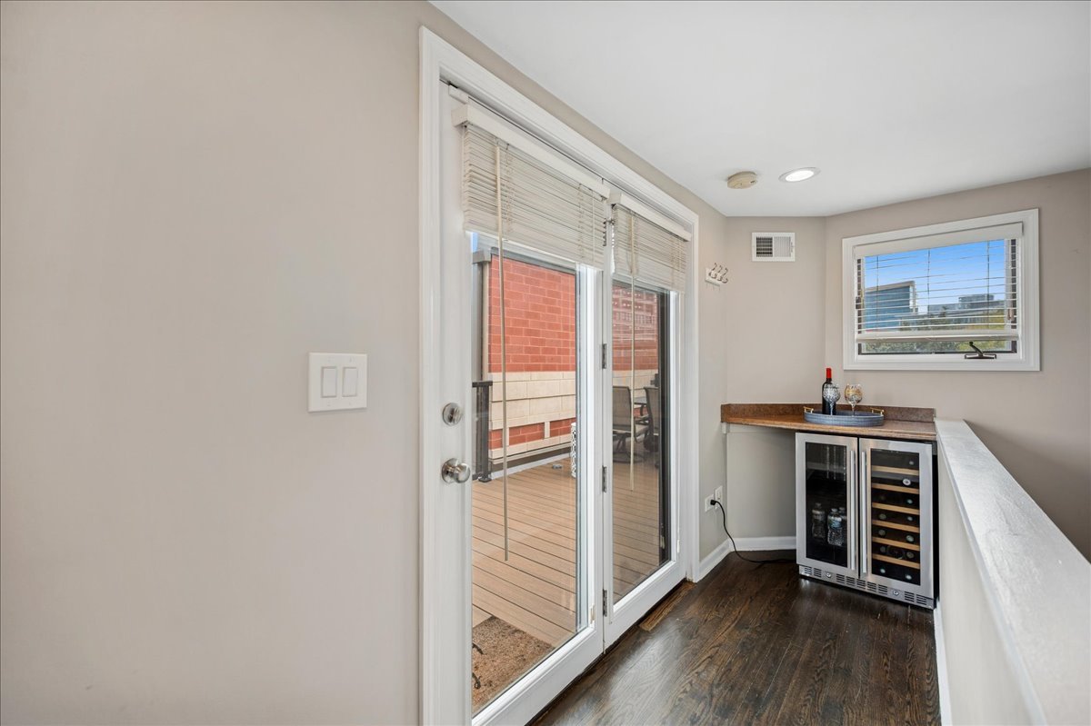 634 West Oak Street Chicago, IL 60610 - Photo 23 of 34 a view of a hallway with bedroom and wooden floor