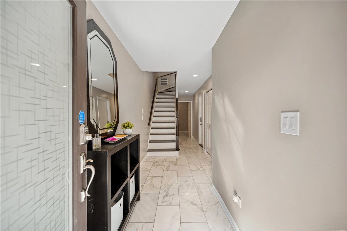 634 West Oak Street Chicago, IL 60610 - Photo 3 of 34 a view of a utility room with stairs and a window