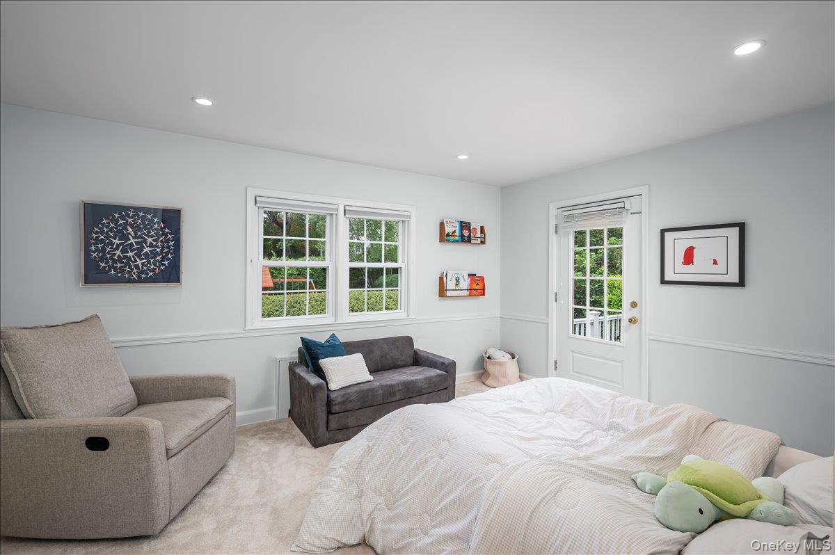 49 Eton Road Larchmont, NY 10538 - Photo 20 of 34 a bedroom with furniture and windows