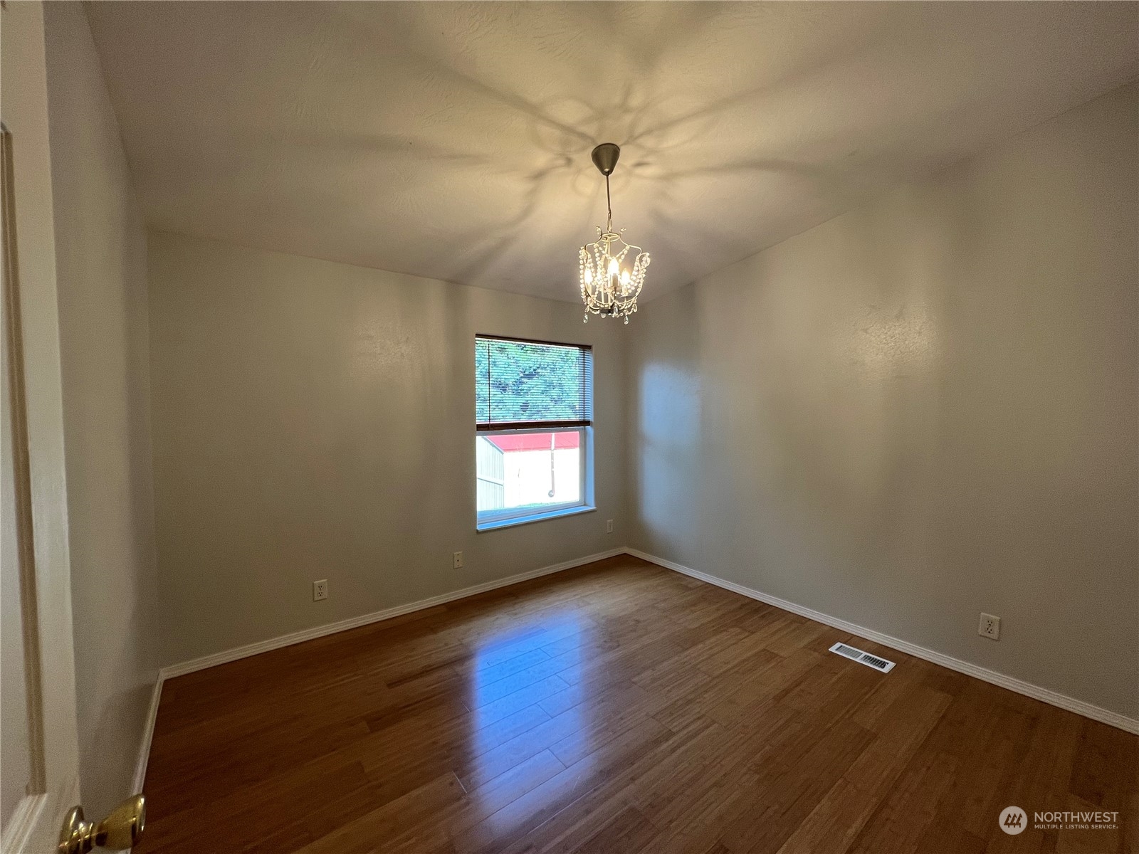 827 Cousins Road, Unit 27 Chehalis, WA 98532 - Photo 23 of 38 wooden floor in an empty room with a window