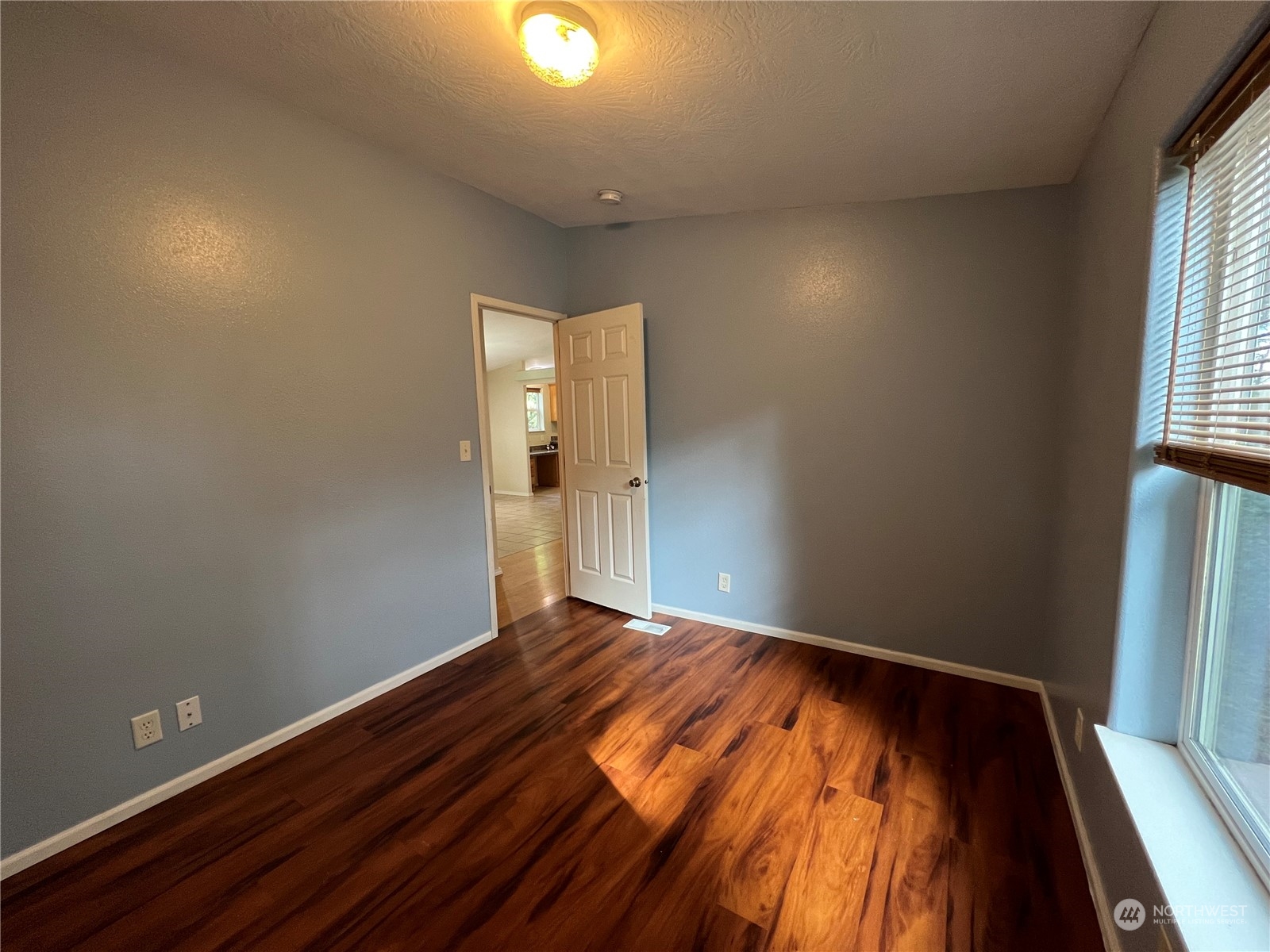 827 Cousins Road, Unit 27 Chehalis, WA 98532 - Photo 27 of 38 wooden floor in an empty room with a window