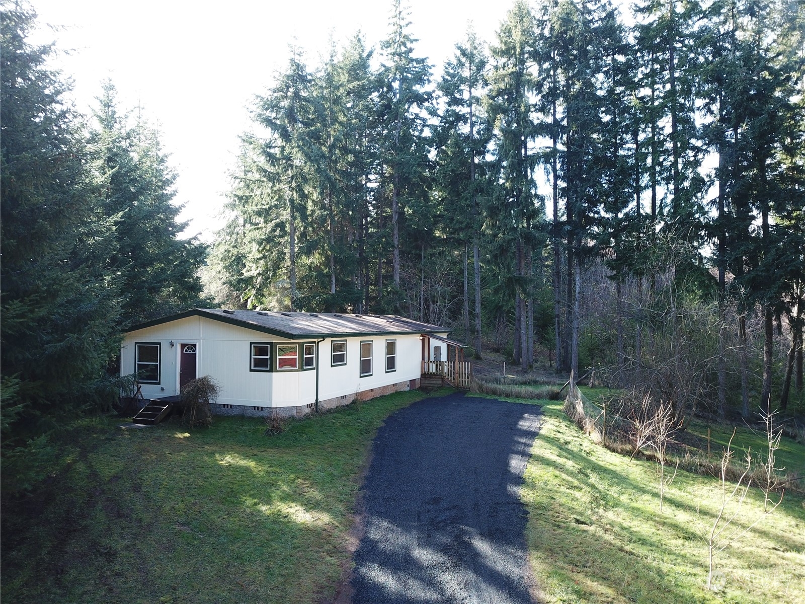 827 Cousins Road, Unit 27 Chehalis, WA 98532 - Photo 3 of 38 a view of a house with backyard and sitting area