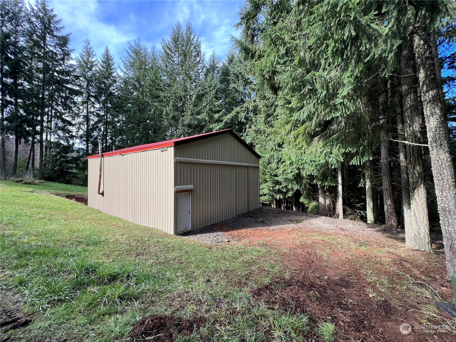 827 Cousins Road, Unit 27 Chehalis, WA 98532 - Photo 4 of 38 a view of backyard with large trees and wooden fence